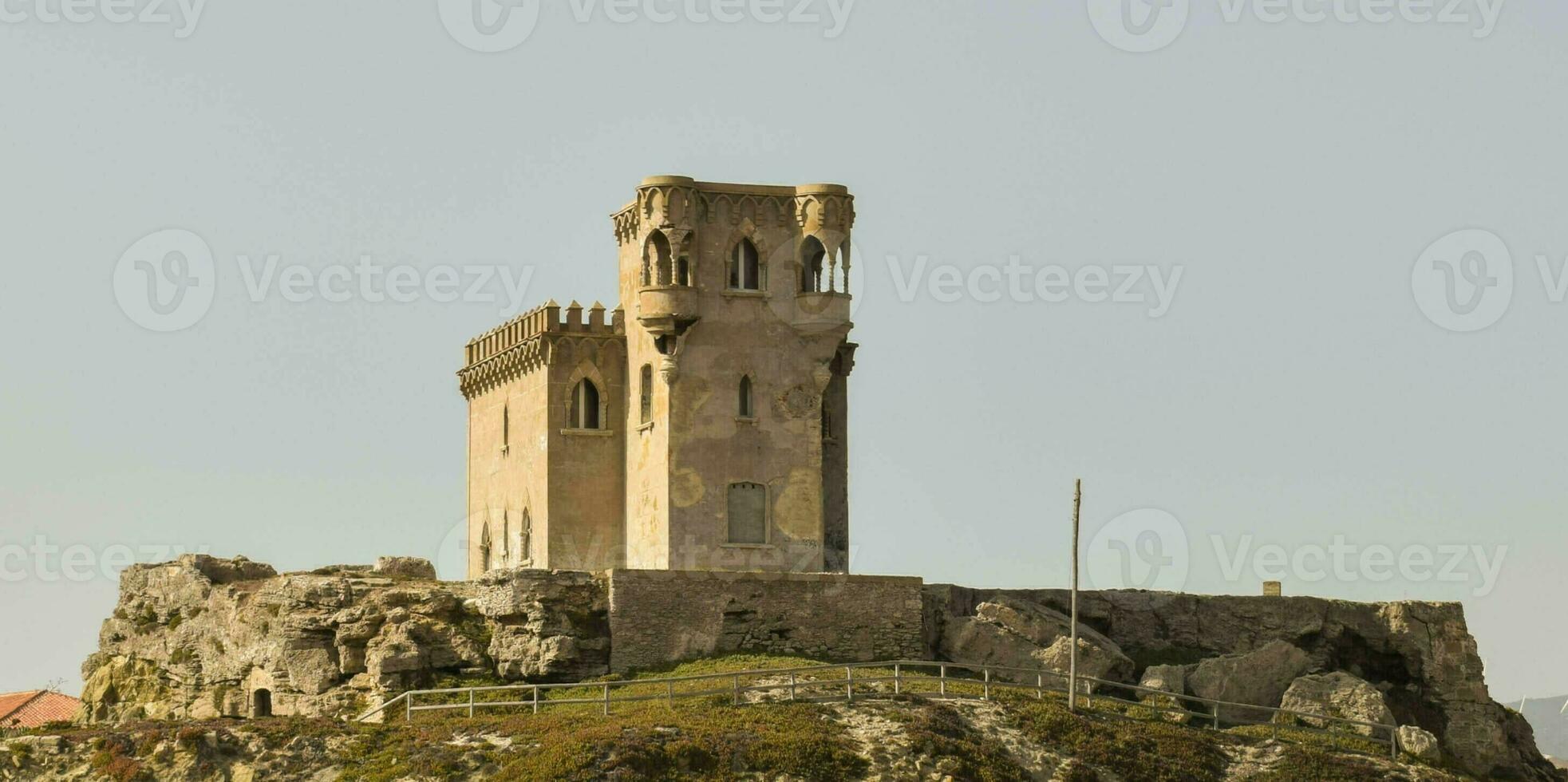 Castle tower fortification ruins at Tarifa sideview photo