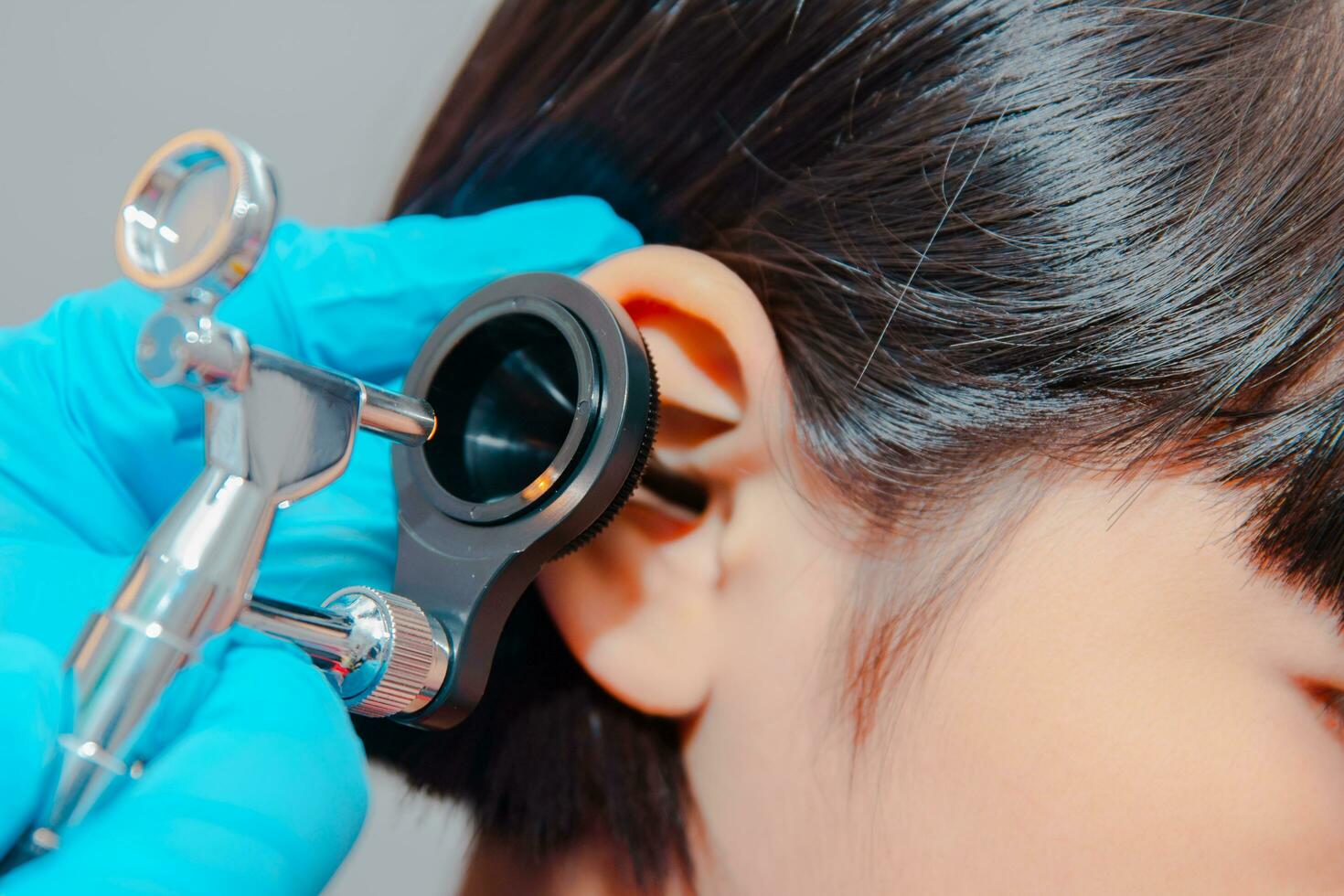 doctor using ostomoscope photo