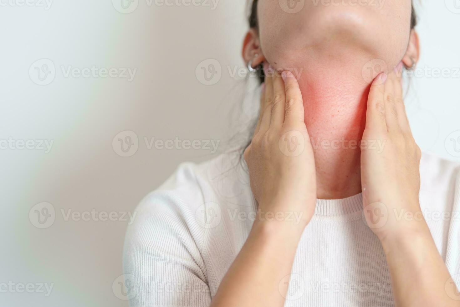 Woman checking Thyroid gland disease. Hand holding Neck pain. Hyperthyroidism, Hypothyroidism, Hashimoto Thyroiditis, Thyroid Tumor and Cancer, Postpartum, Papillary Carcinoma and Health concept photo