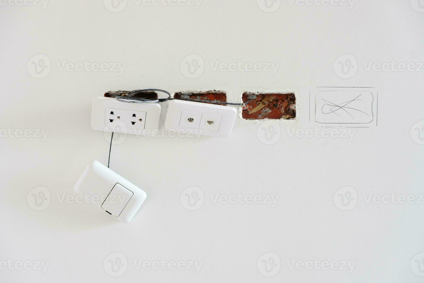 Electrical Wiring under plaster, hidden installation cables for socket to a concrete. Renovation, Repair and development of home and apartment concepts photo