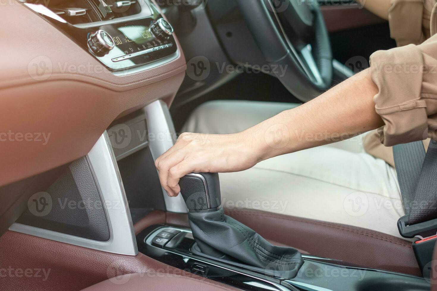 woman driver stick shift transmission a car gear, hand controlling steering wheel during vehicle moving. Journey, trip and safety Transportation concepts photo