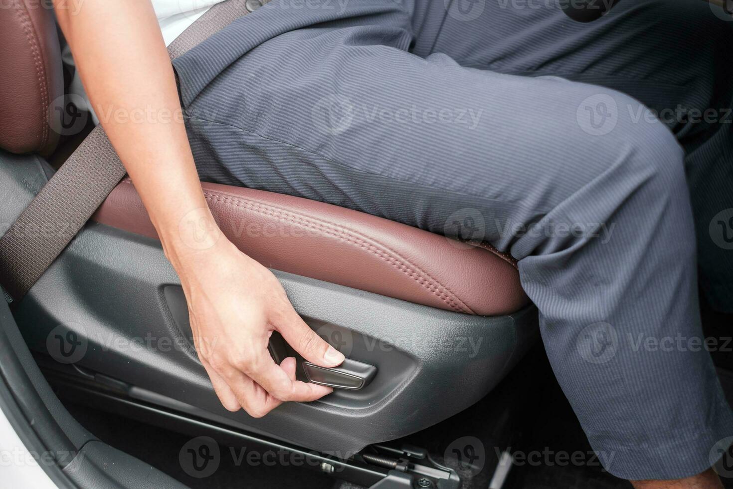 Hand adjust car seat before drive on the road . Ergonomic and safety transportation concept photo