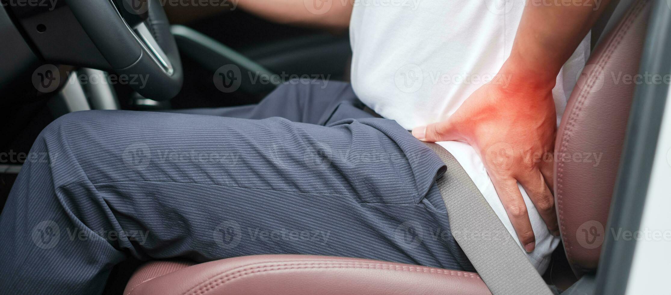 man with his back sprain while driving car long time, back body ache due to Piriformis Syndrome, Low Back Pain and Spinal Compression. Ergonomic and medical concept photo