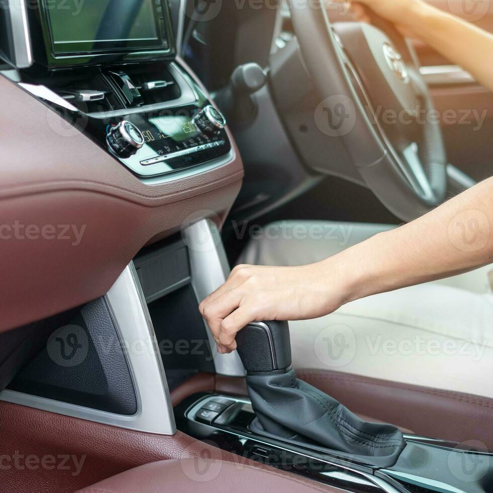 woman driver stick shift transmission a car gear, hand controlling steering wheel during vehicle moving. Journey, trip and safety Transportation concepts photo