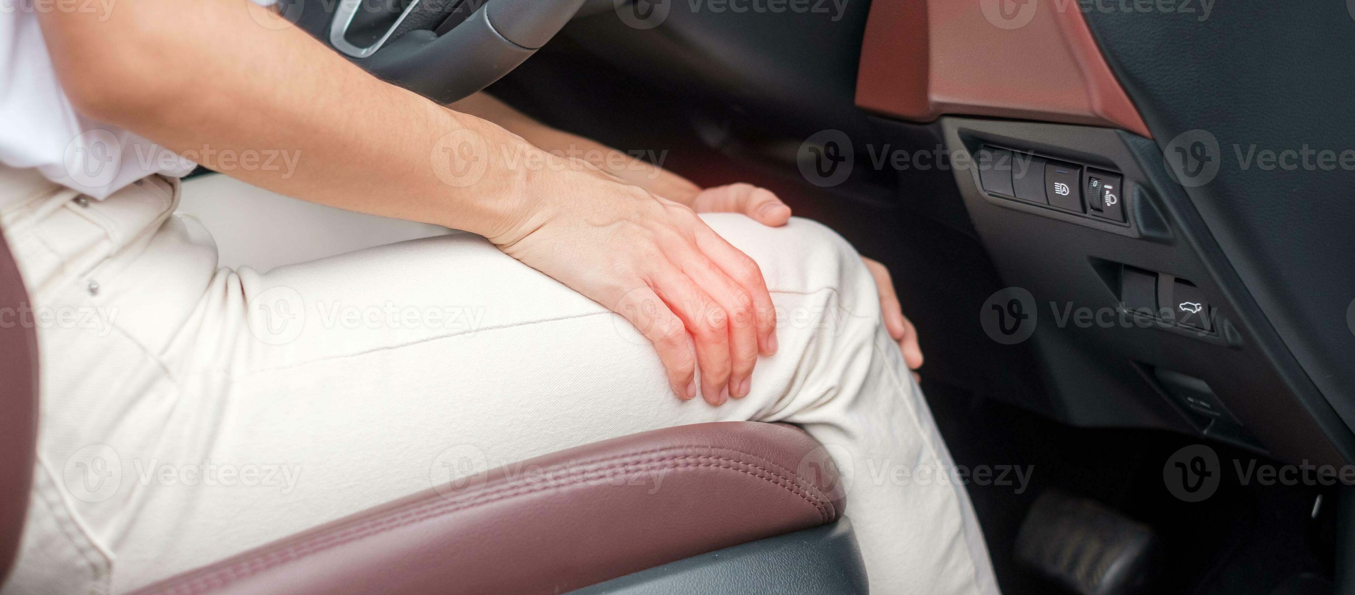 woman with her knee sprain while driving car long time, Patellofemoral Pain Syndrome