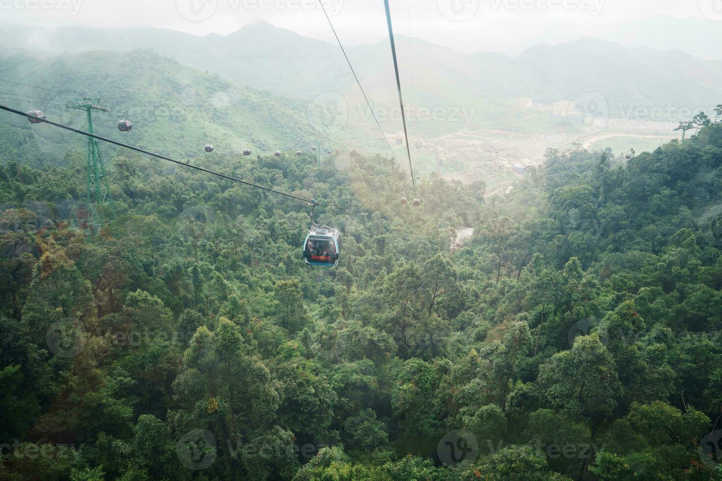 View of Ba Na Hills Mountain in the fog from Cable car. Landmark and popular. Da Nang, Vietnam and Southeast Asia travel concept photo