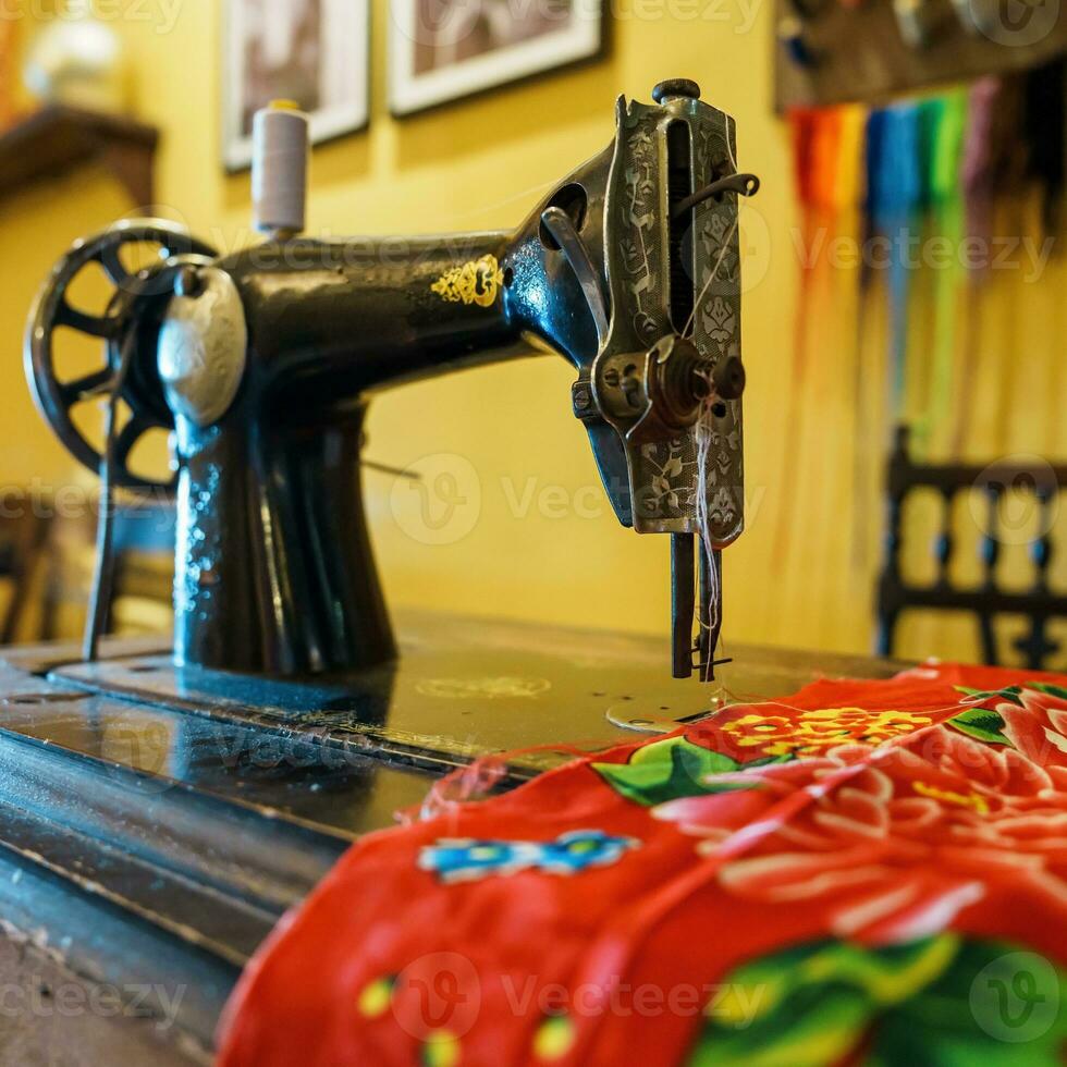 Old Sewing machine on table photo