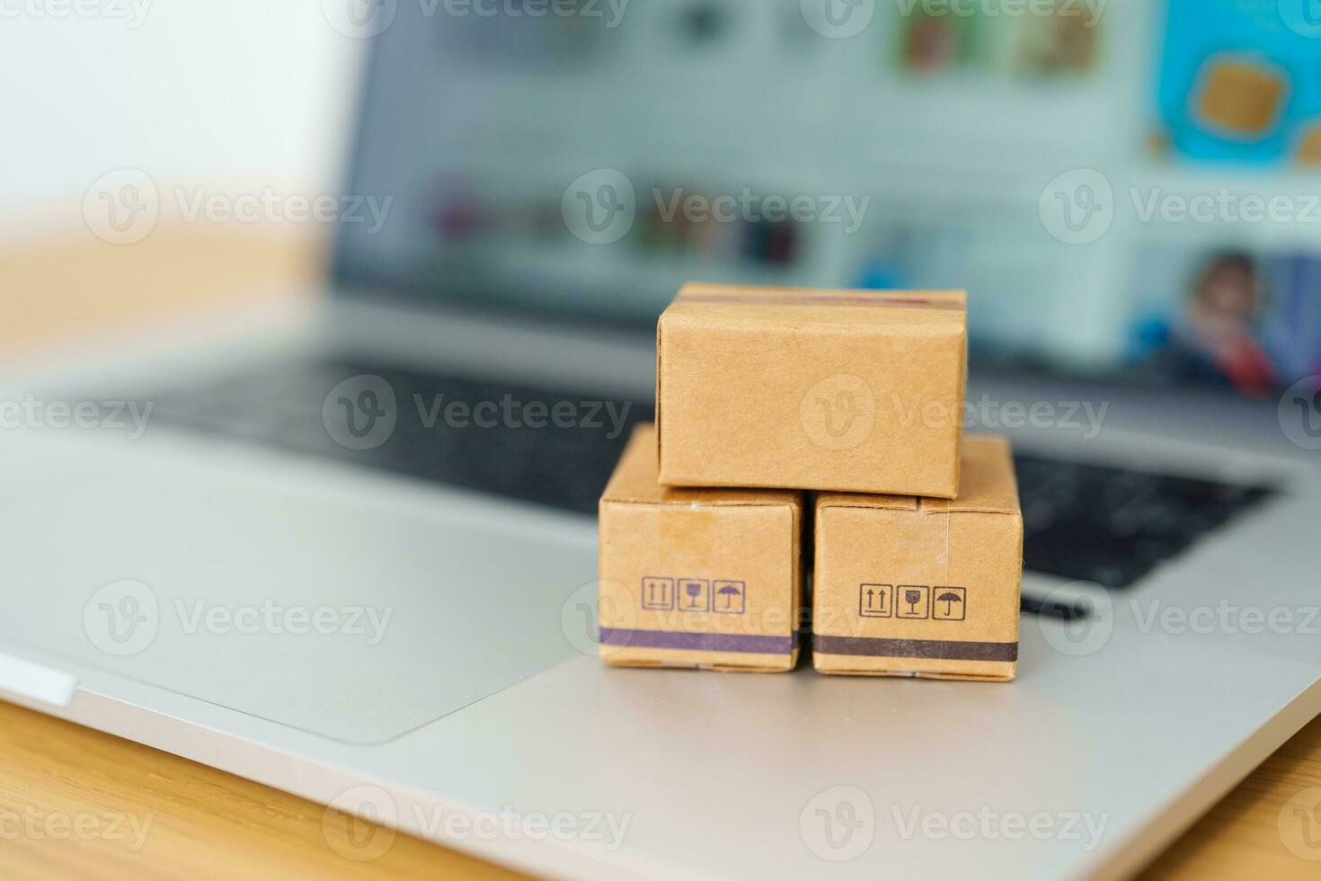 Boxes on laptop computer. online shopping, Marketplace platform website, technology, ecommerce, shipping delivery, logistics and online payment concepts photo