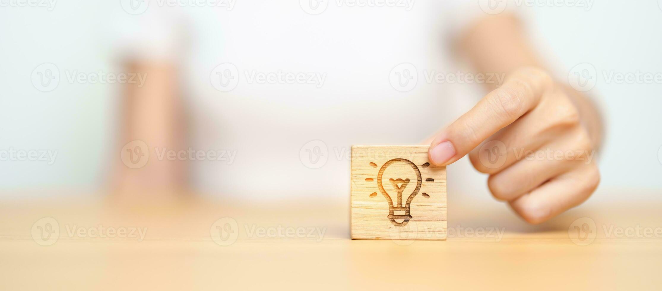 hand hold lightbulb  block with business Idea, strategy, innovation , creativity, learning, brainstorming  and success concept photo