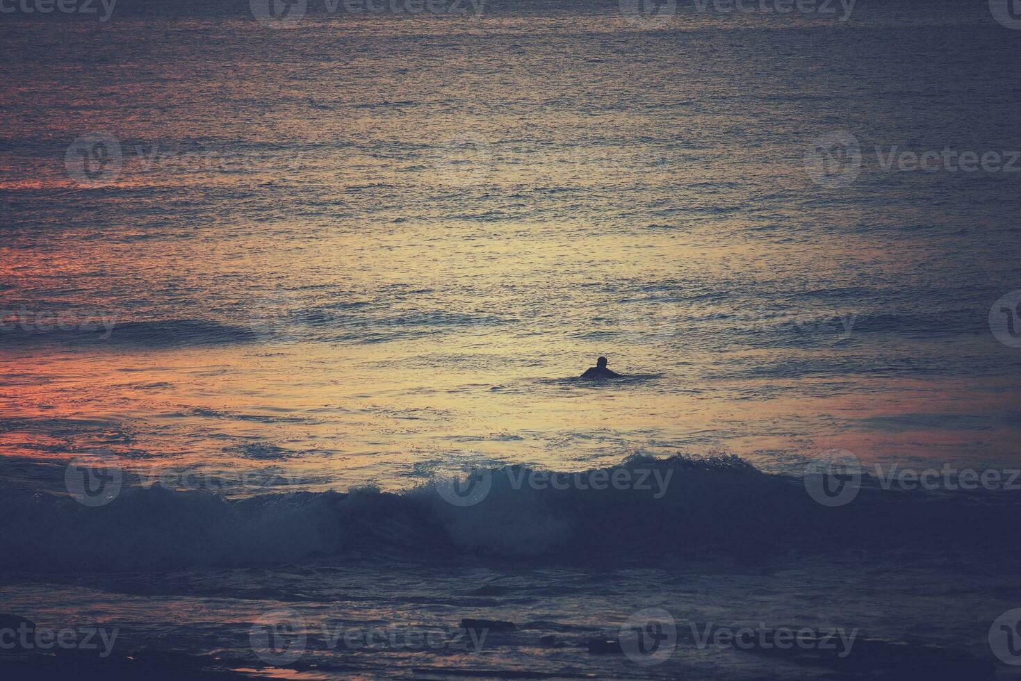 picturesque ocean landscape with the setting sun in a tropical country during summer holidays photo