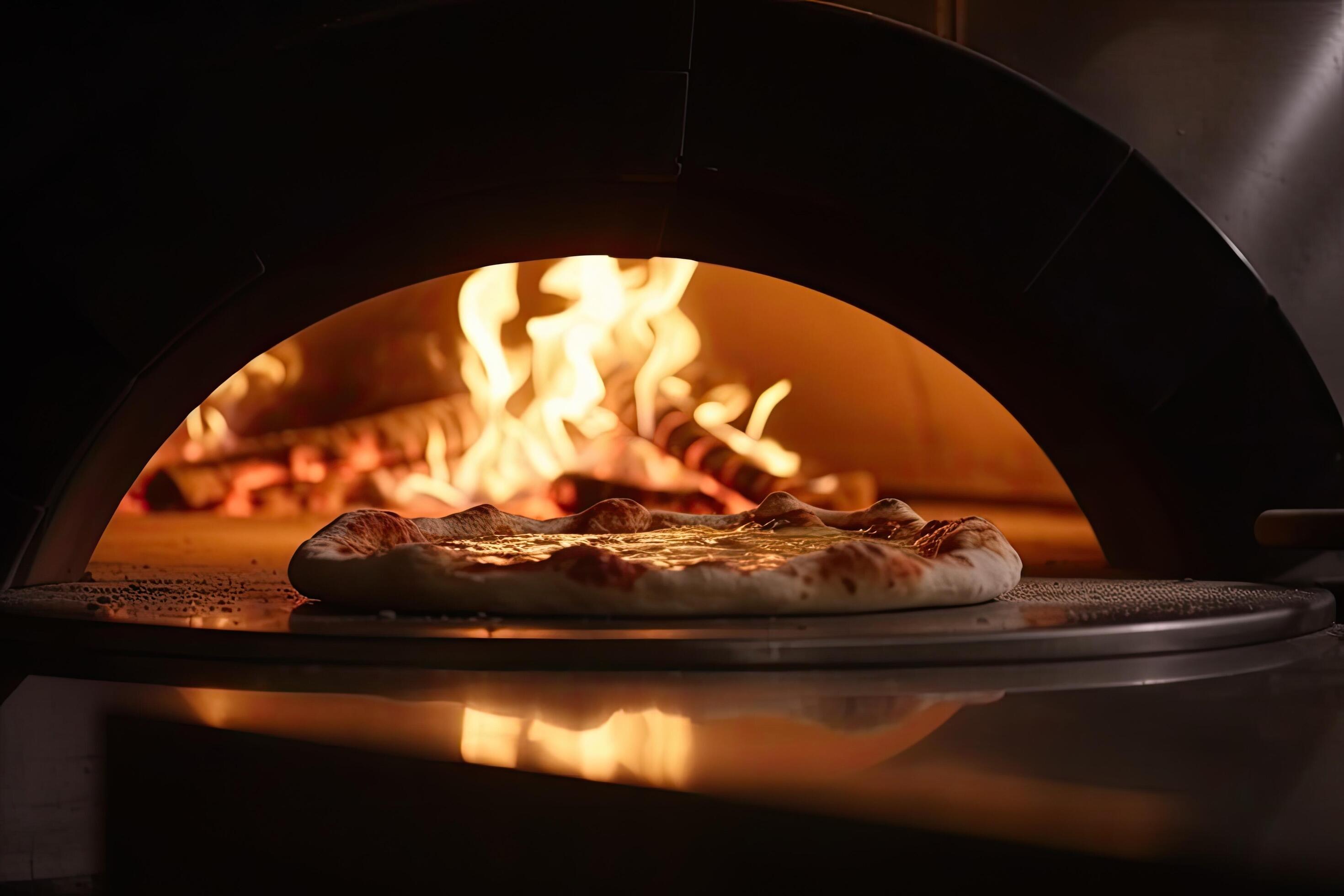 Pizza in the oven with a fire in the background. Restaurant, chefs