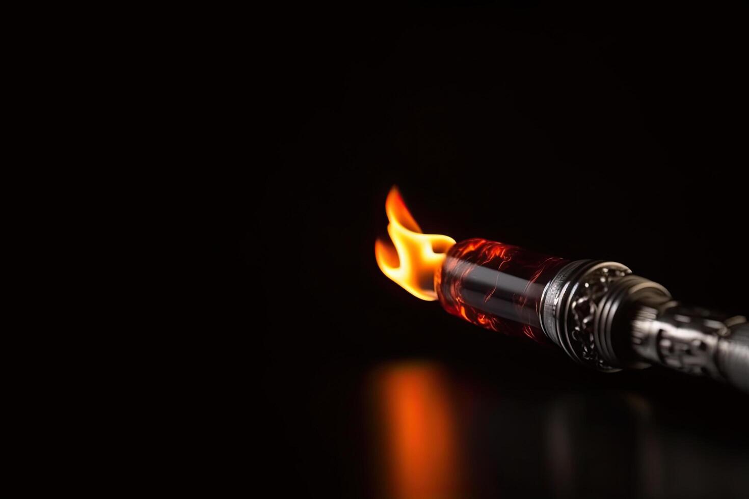 Gas lighter with flame on black background, closeup. Space for text, Fire torch on a dark background, photo