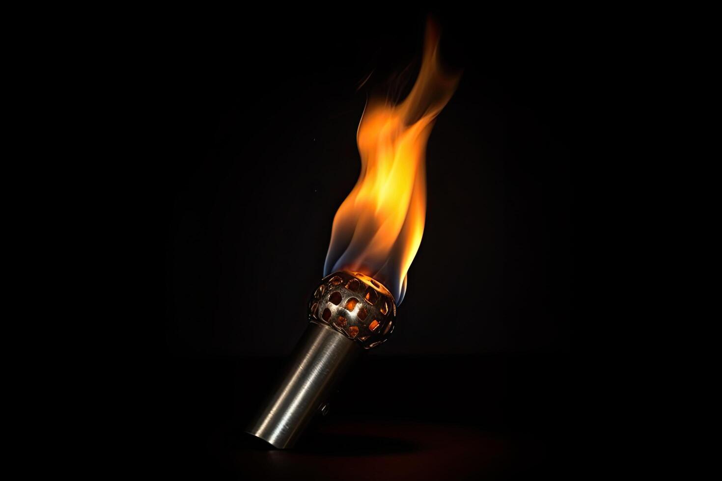 Burning torch on a black background, close-up, Fire torch on a dark background, photo