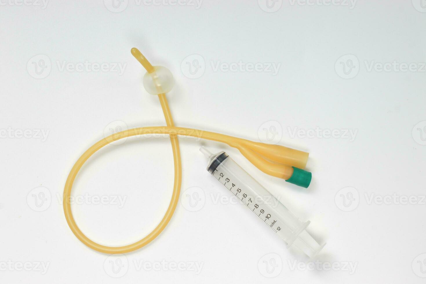 Urinary catheter with syringe 10 ml on a white background, test photo