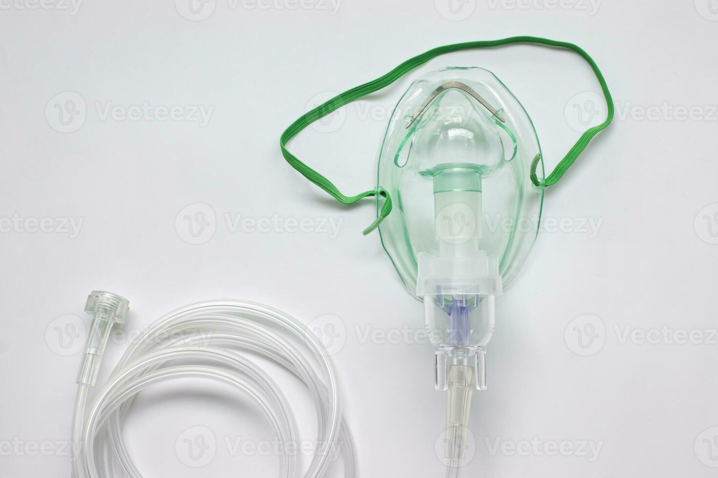 Oxygen mask with inhaler bulb on a white background. photo