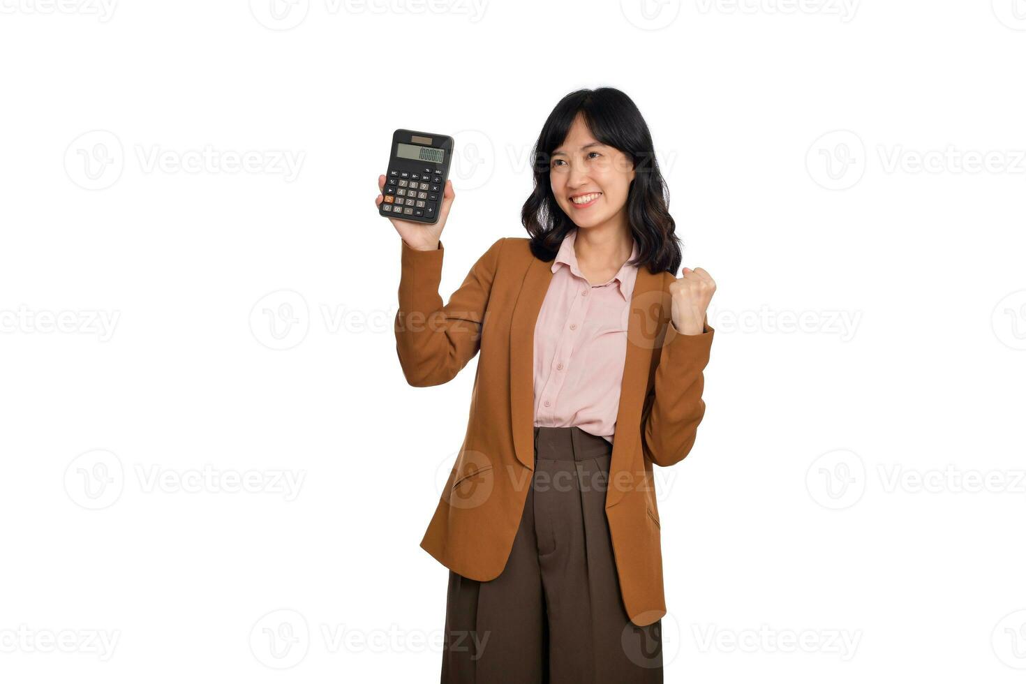 Tax day concept. Happy asian woman confident smiling holding calculator and fist up, Portrait happy Asian female isolated on white background, Account and finance counting income photo