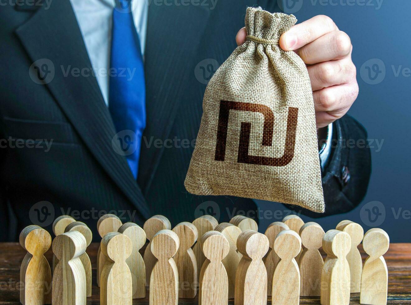 Businessman holds out a israeli shekel money bag to the crowd. Providing money, paying salaries and grants. Official. Staff maintenance. Financial support. Tax collection. Compensation payments. photo