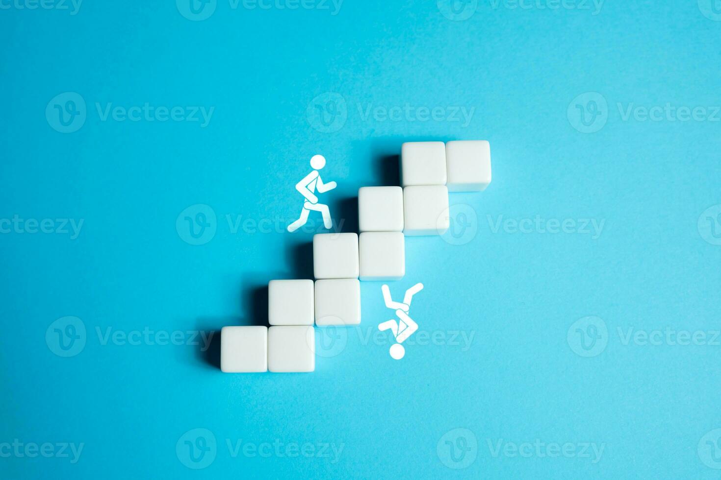 People are chasing each other up the inverted stairs. The illusion of repeating the success of another person. Delusion in goals and desires. Competition, rivalry. photo