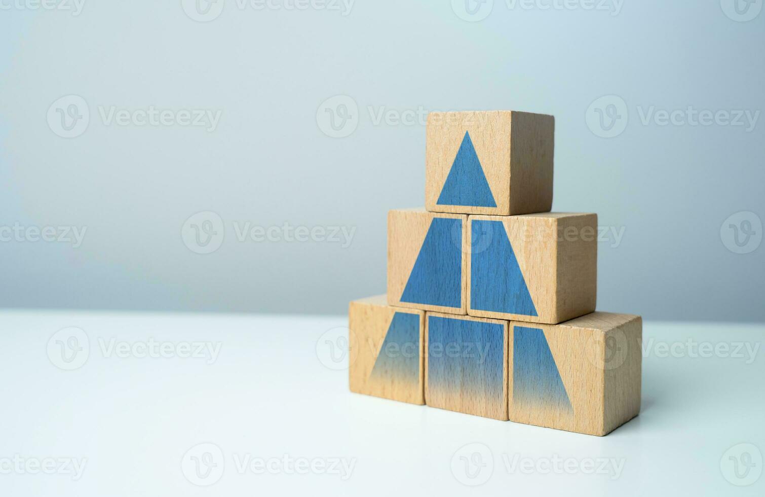 Pyramid with hierarchical structure. Development, promotion. Career advancement. Achieve success and conquer new heights. Growth in sales, profits and visitors. Strength and solidity photo