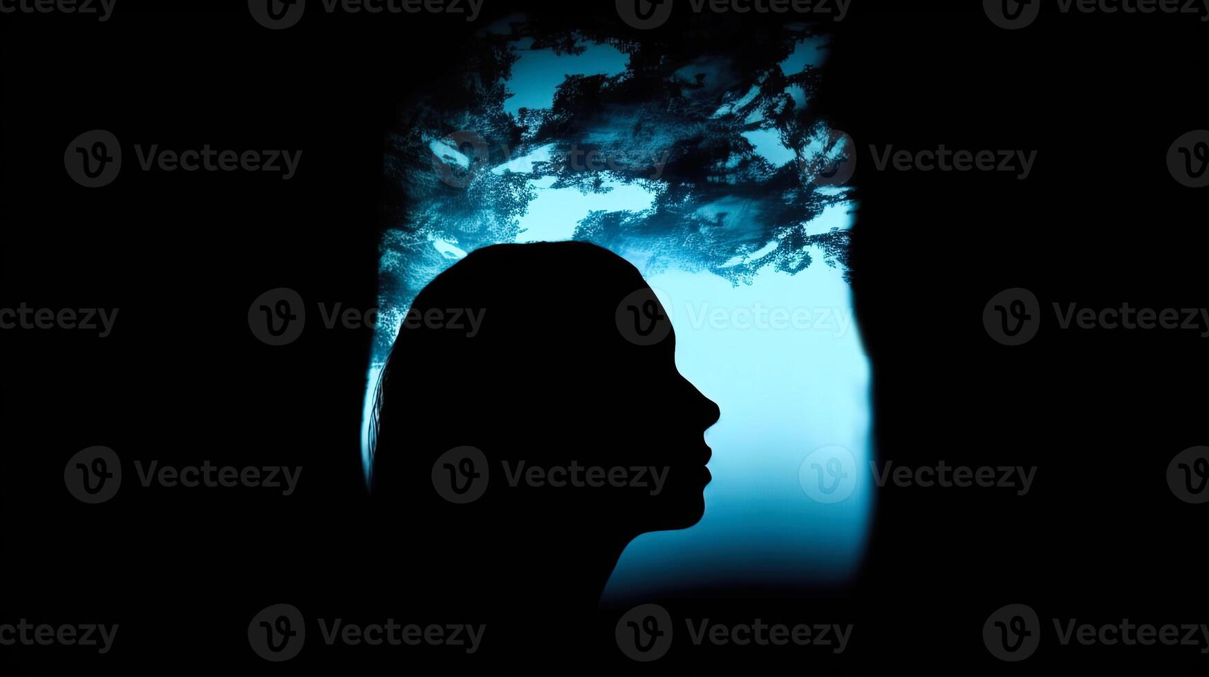 Silhouette of a woman with smoke coming out of her head. . photo