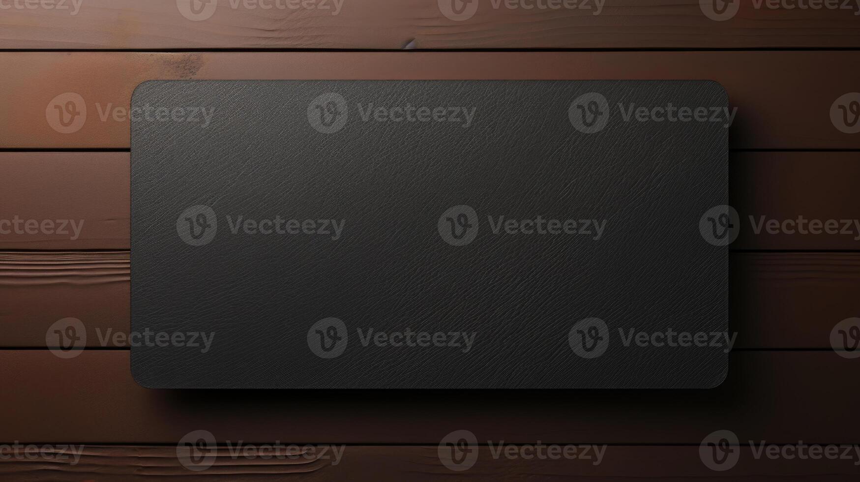 Black leather box on a wooden background. . photo