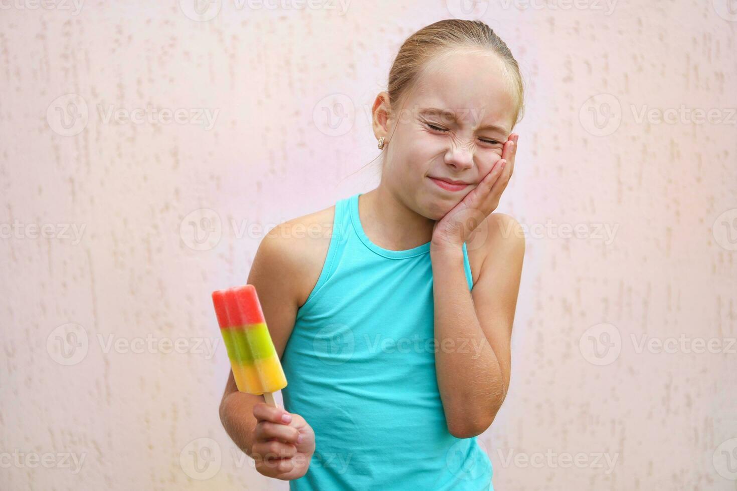 Girl has toothache from cold ice cream. 25555289 Stock Photo at Vecteezy