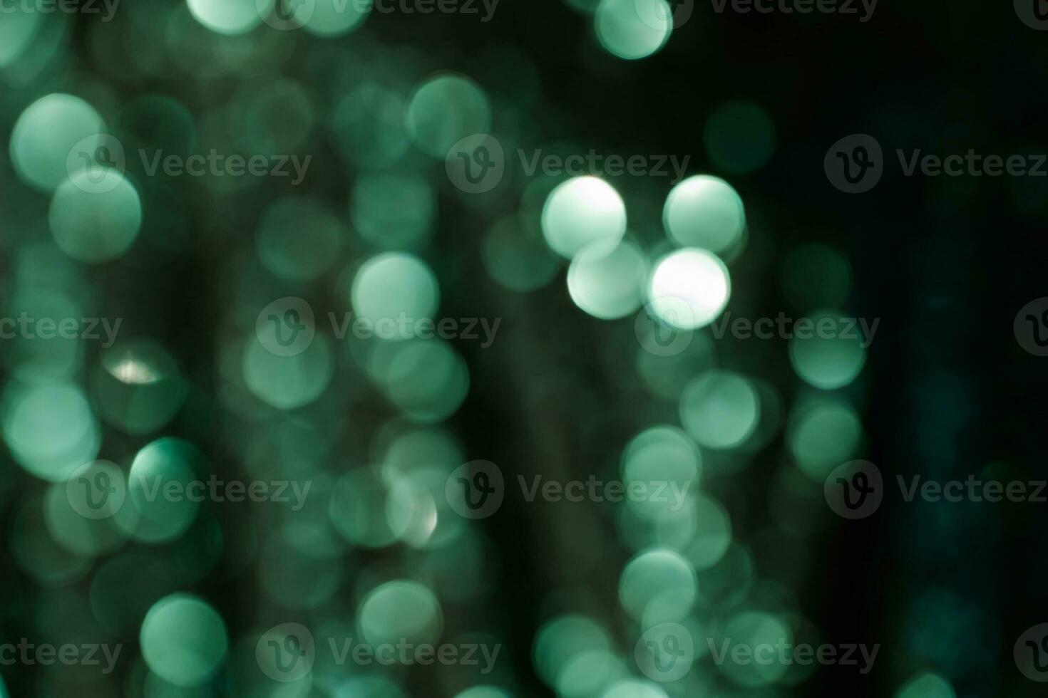 Abstract bokeh background of emerald green color. photo