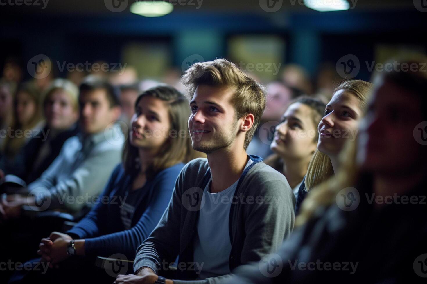 students listening to lecture at a lecture theatre with photo