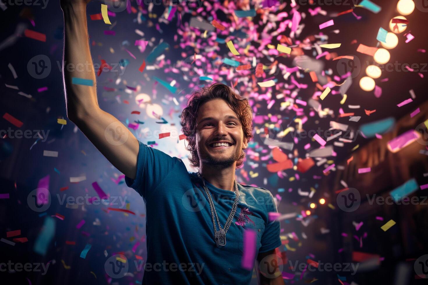 a happy winner on stage holding trophy in his hands with colorful light confetti with photo