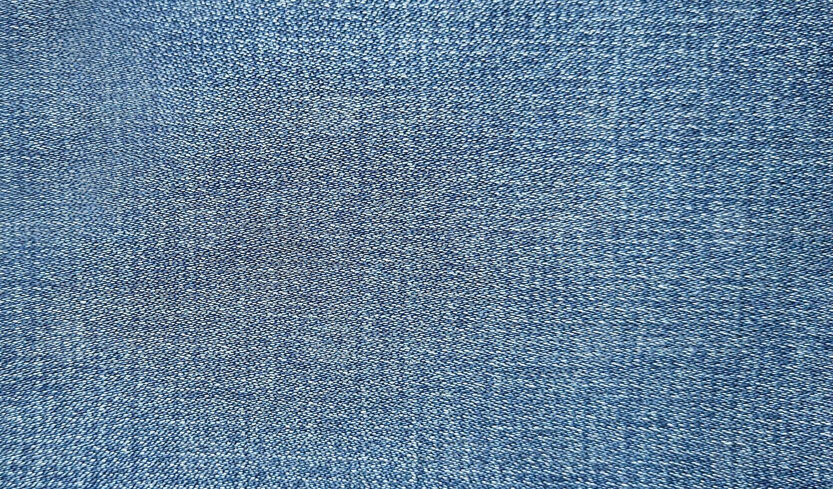 Light Blue denim fabric close up photography background, stone wash denim jeans cloth, denim texture, photo