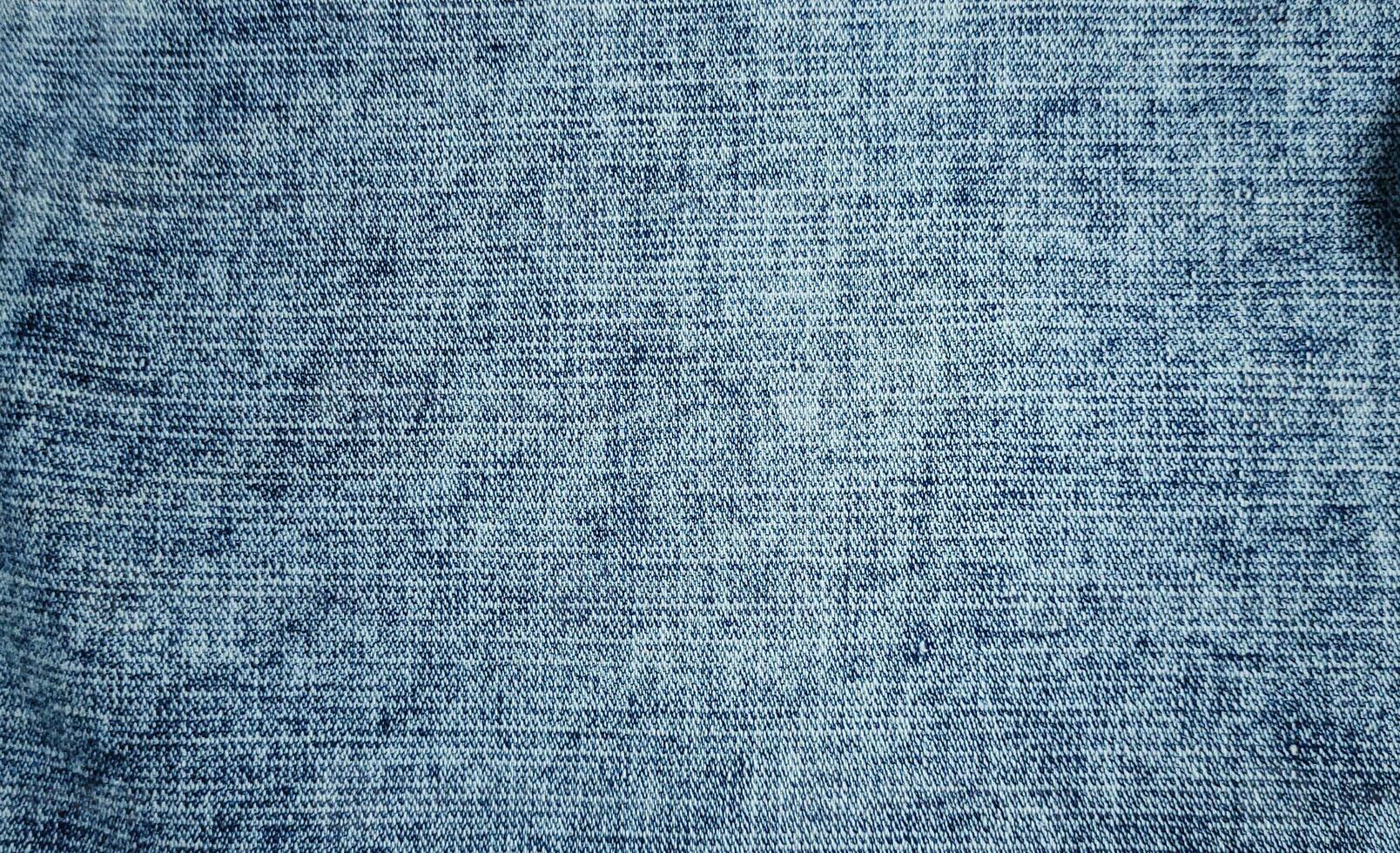 Light Blue denim fabric close up photography background, stone wash denim jeans cloth, denim texture, photo