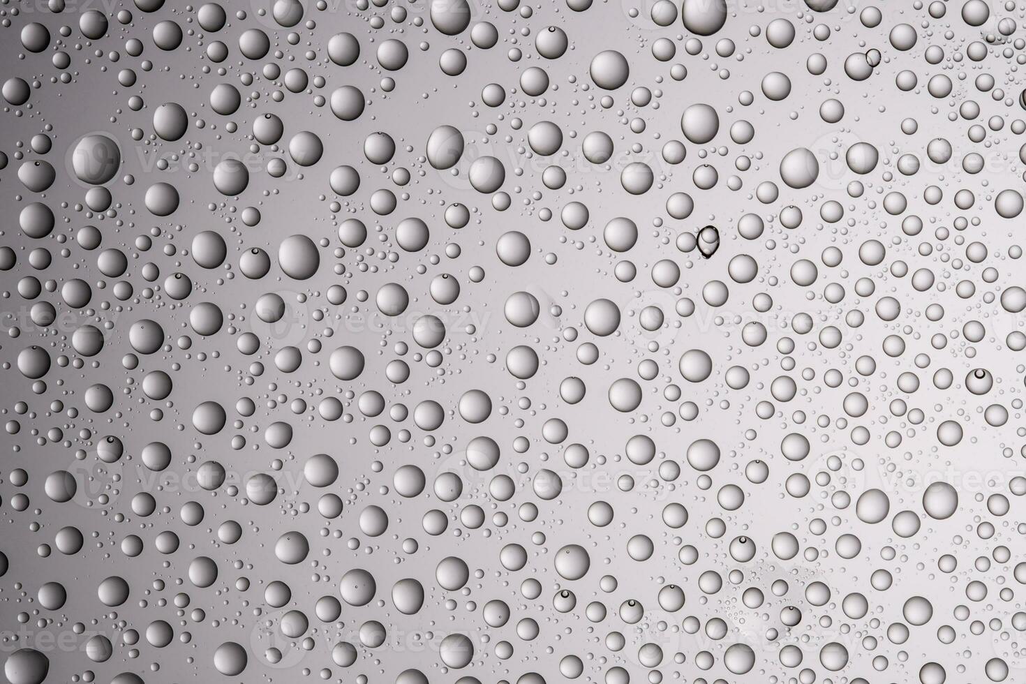Drops of water on a transparent gray background. photo