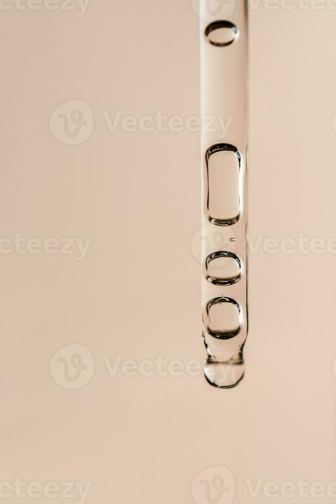Cosmetic product in a pipette with bubbles. photo