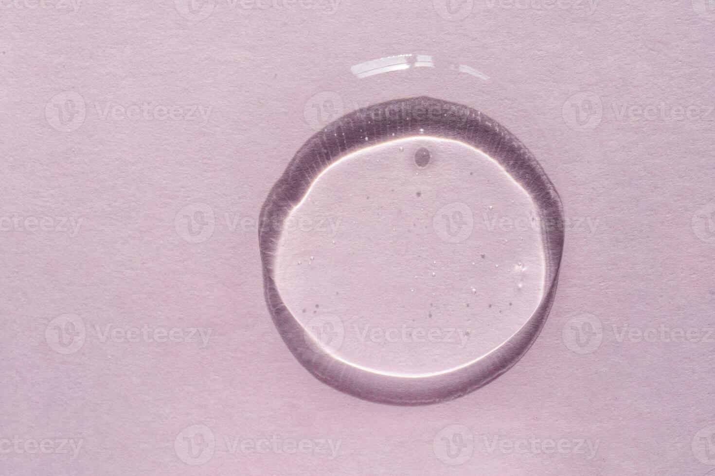 Transparent gel texture on a lilac background. photo