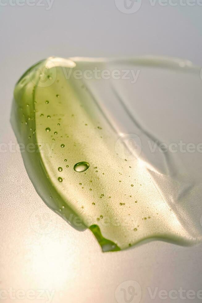 Green gel texture of a cosmetic care product. photo