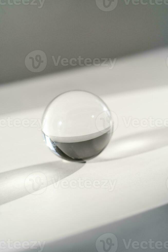 Transparent crystal ball on a white background. photo