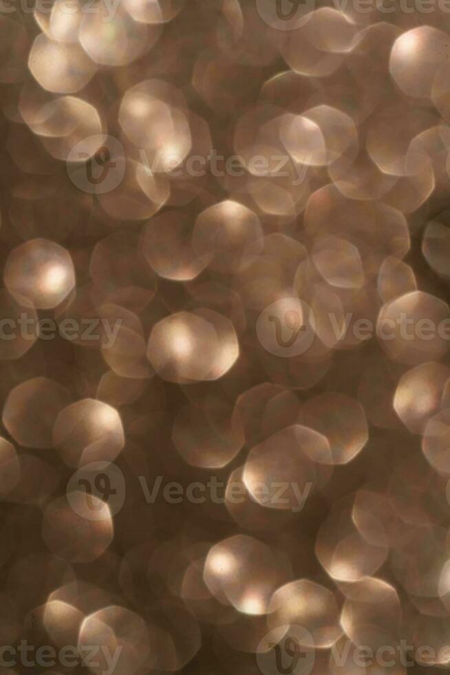 Gold abstract glitter background with shiny bokeh photo