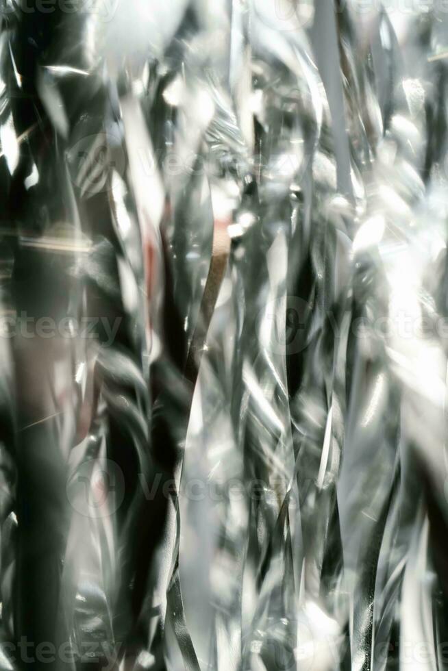 Abstract atmospheric background of tinsel with bokeh. photo