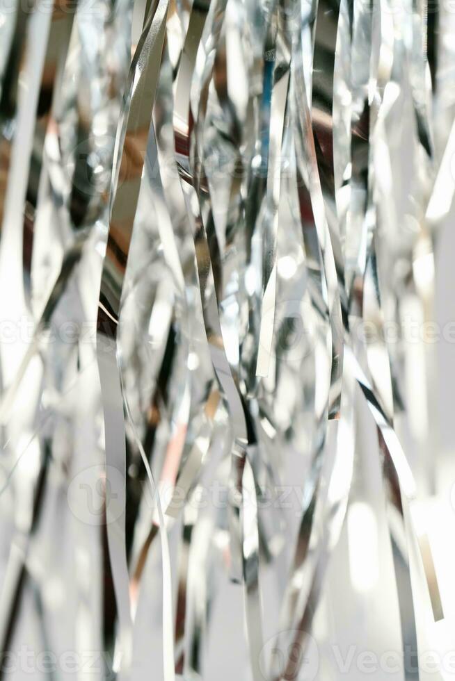 Abstract atmospheric background of tinsel with bokeh. photo