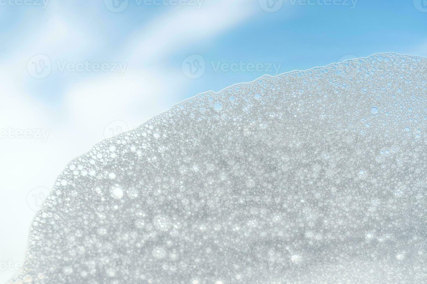 Texture of white foam on a sky background. photo