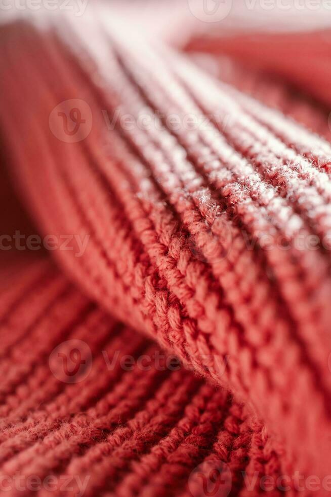 Knitted texture of a pink sweater or scarf close-up. photo