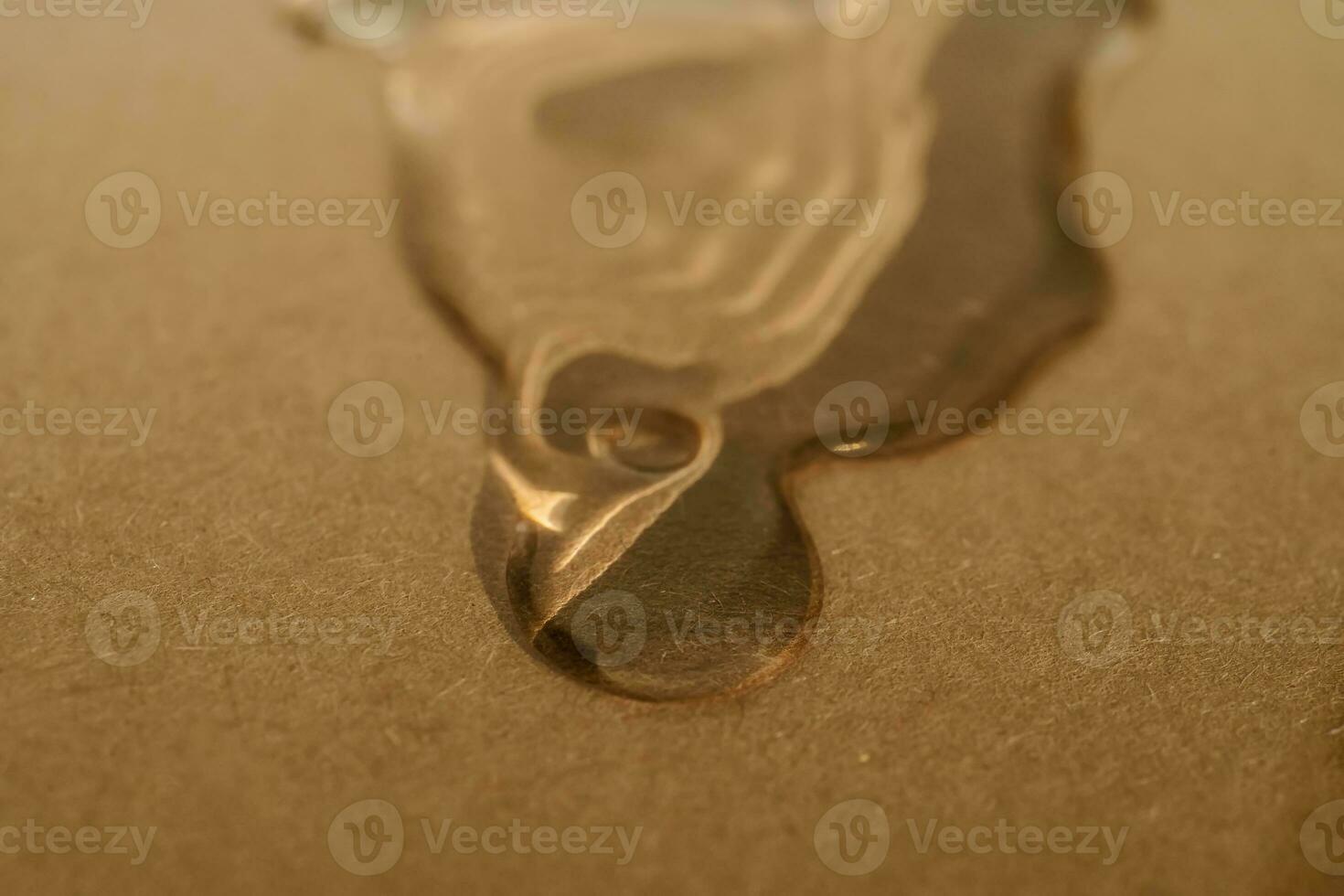 A drop of cosmetic product on a beige background. Texture. photo
