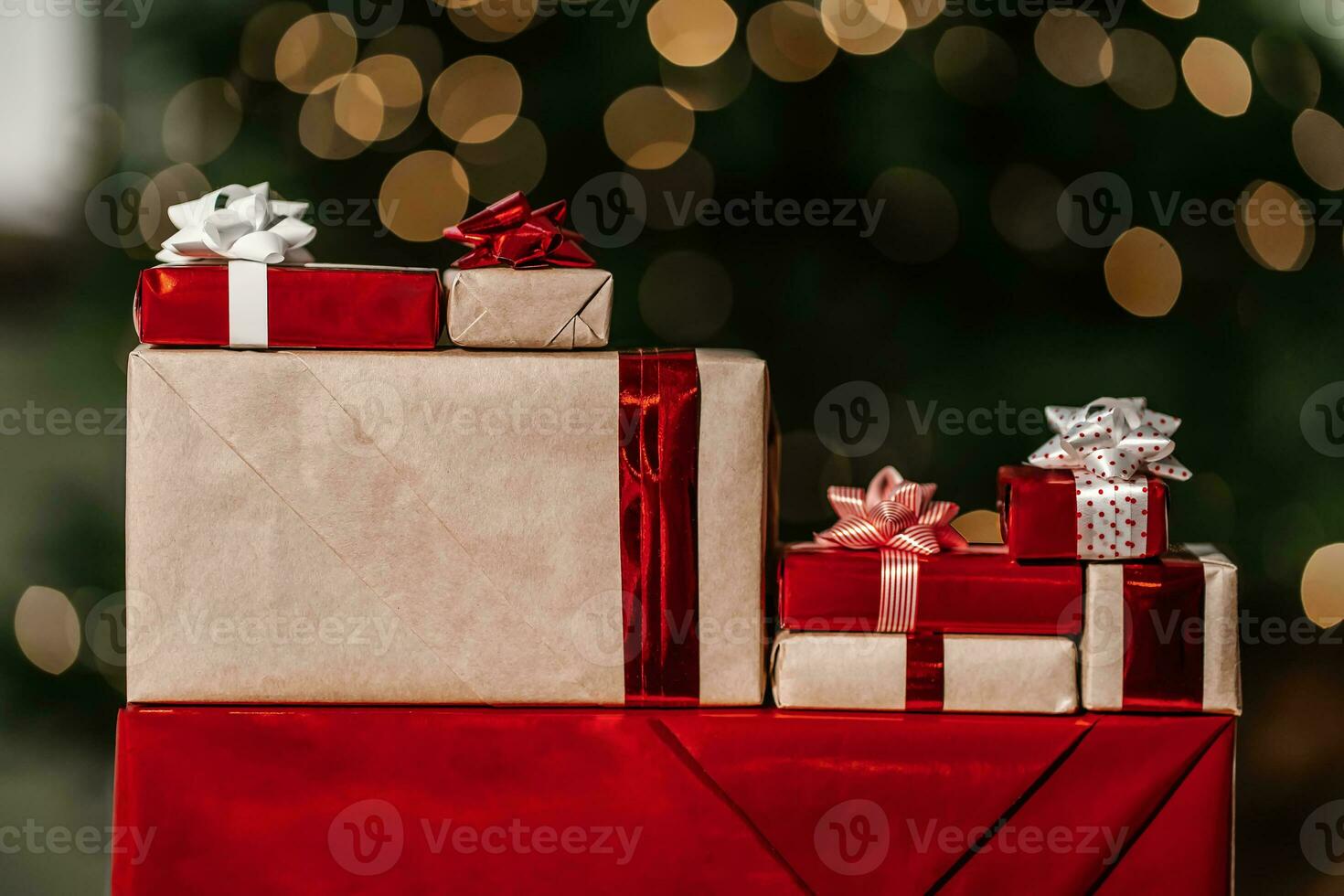 Gifts on the background of a Christmas tree with a bokeh. photo