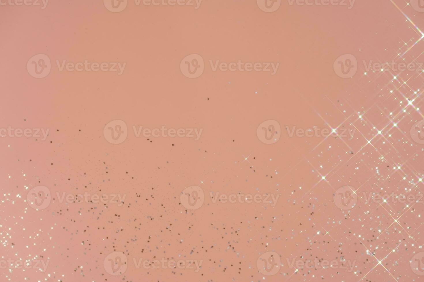 Abstract pink background with sparkles in the shape of stars. photo