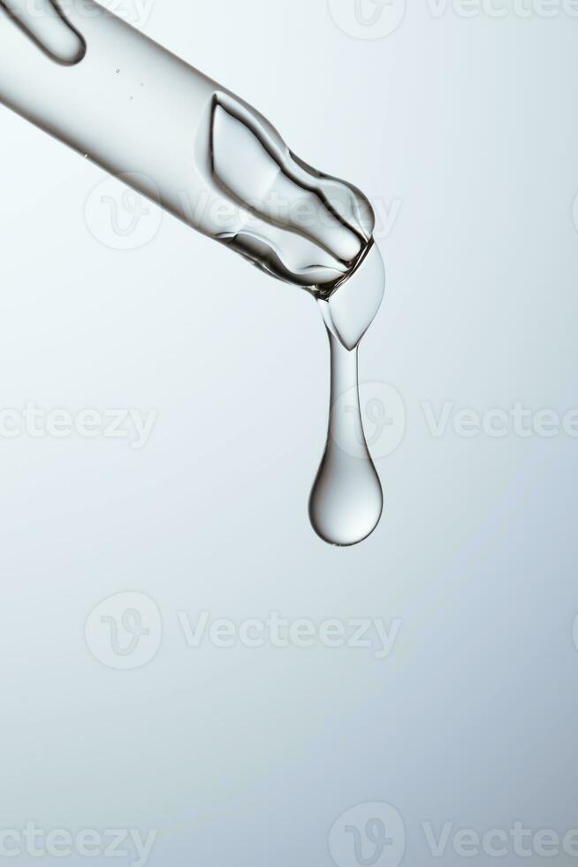 Pipette with serum, gel, oil or other cosmetic product. photo