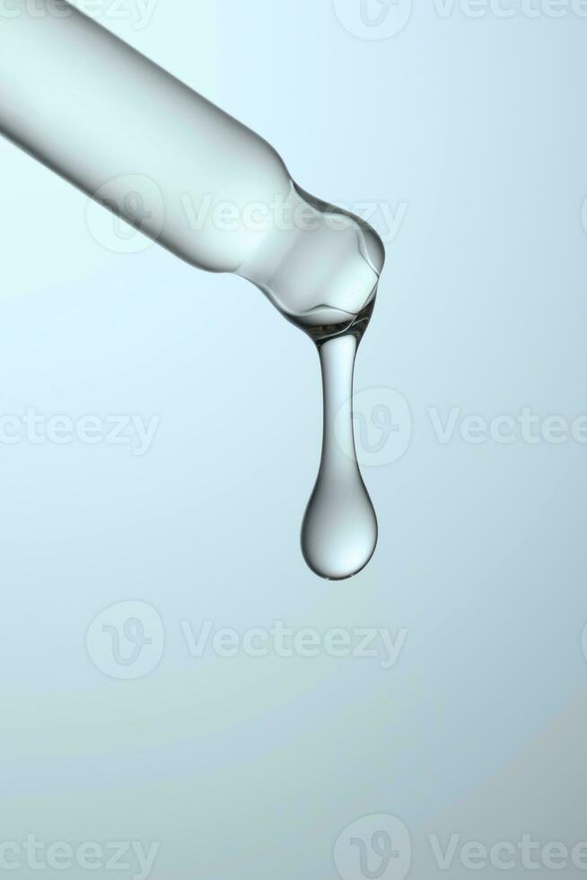 Pipette with serum, gel, oil or other cosmetic product. photo