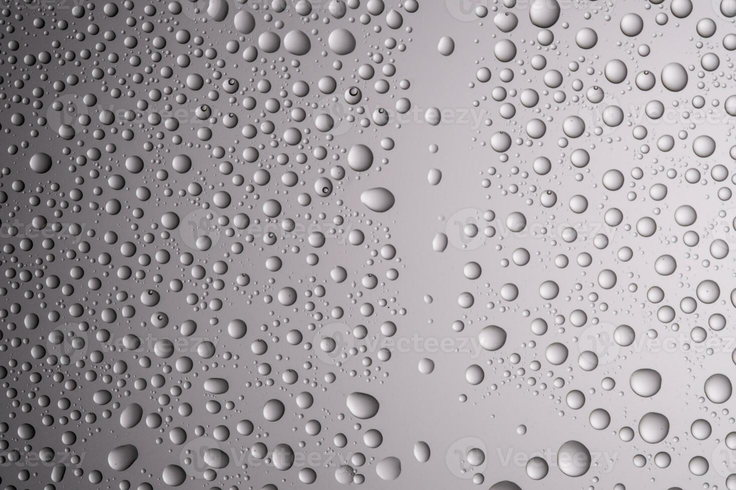 Drops of water on a transparent gray background. photo