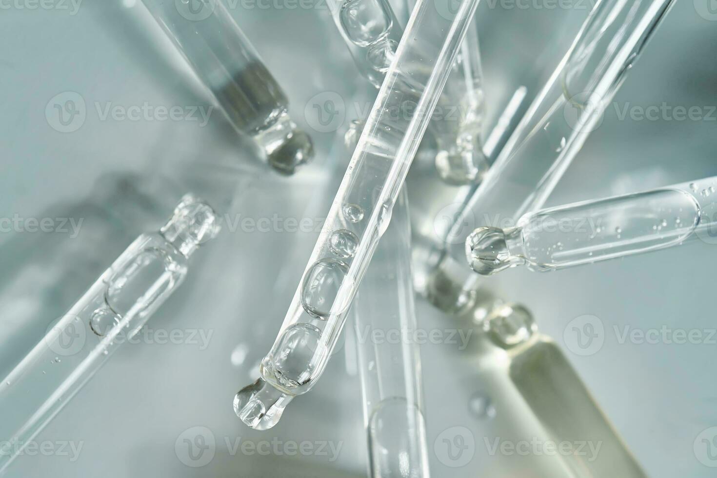 There are a lot of pipettes from cosmetics in one photo. photo