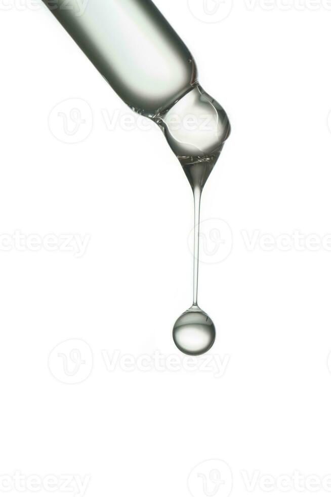 Pipette with a drop of cosmetic product on a white background. photo