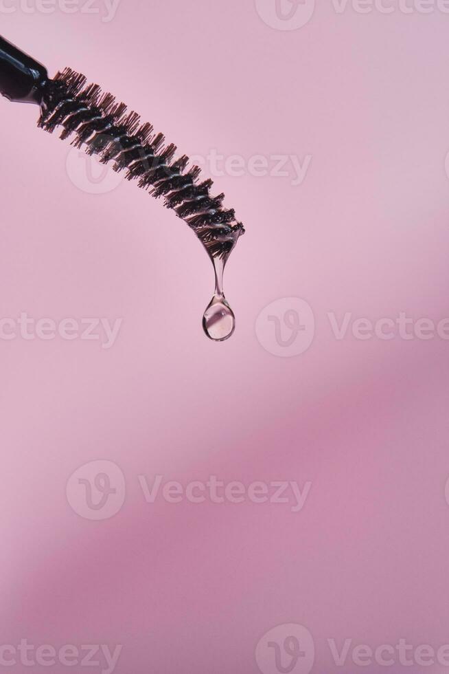 Cosmetic oil for the growth of eyebrows and eyelashes with a brush. photo